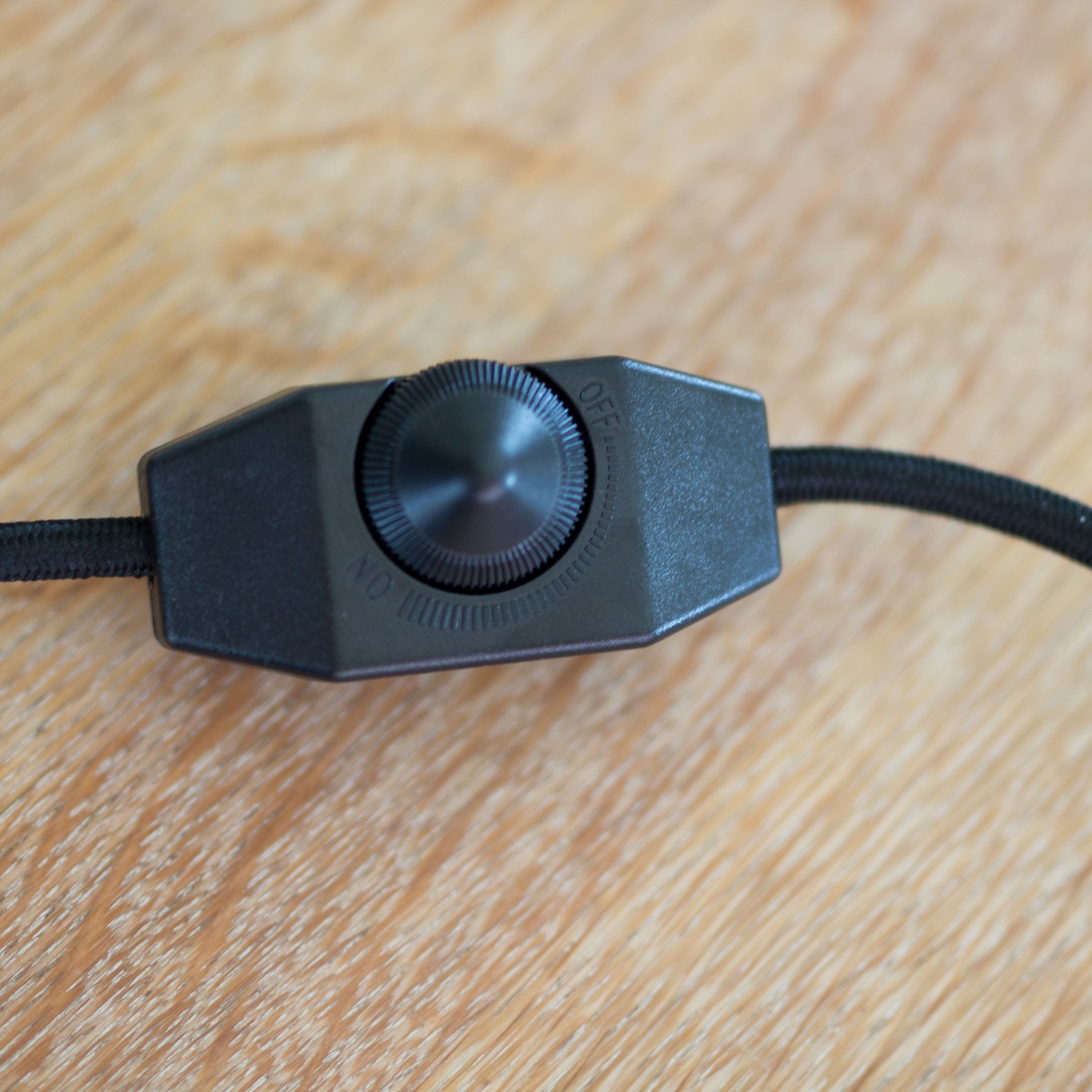 Black fabric cord with a dimmer switch