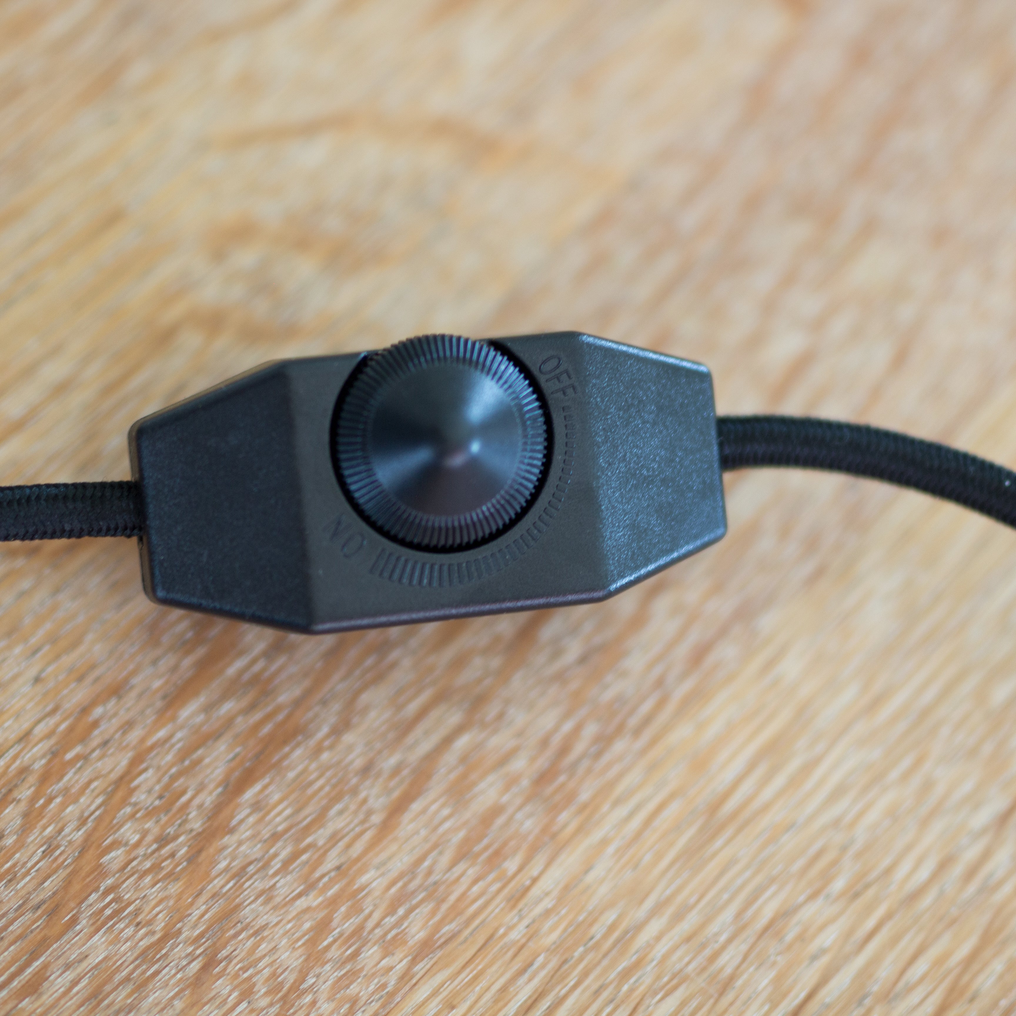 Black fabric cord with a dimmer switch