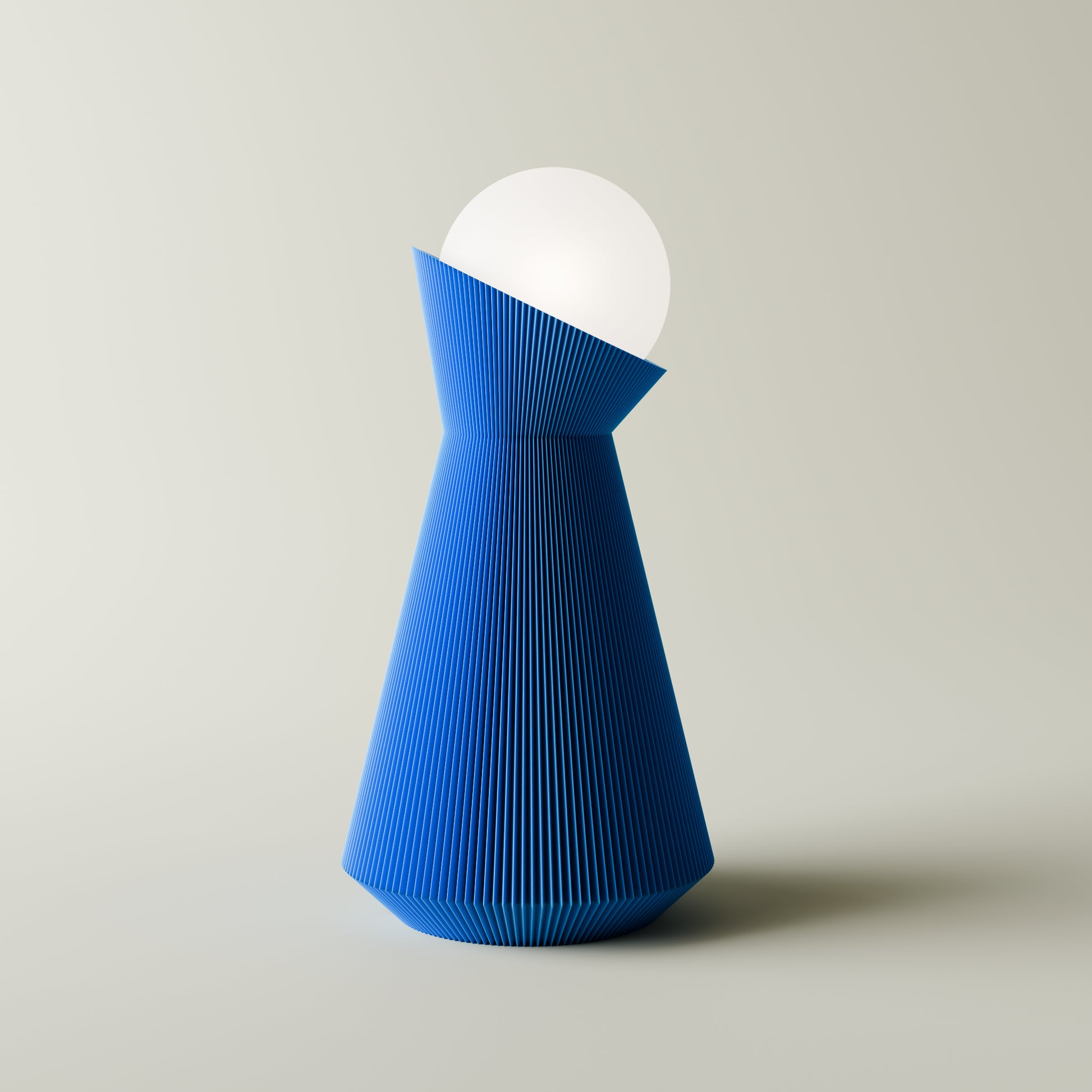 Blue and white geometric lamp on a light gray background