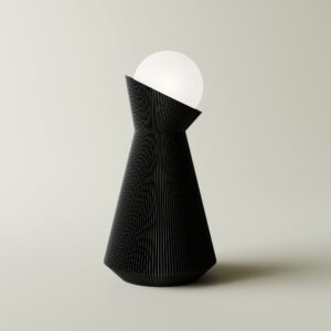Charcoal Sera table lamp with a white decorative bulb on a light grey background