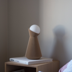 Desert tan Sera table lamp on a shelf